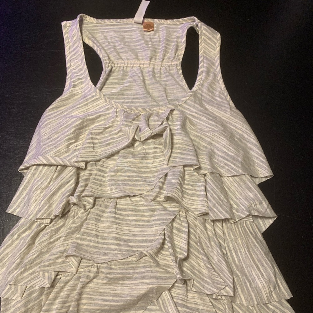 Grey and white striped woman’s tank top with ruffles